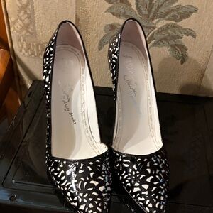 Black and White Laser-Cut Pointed Toe Pumps